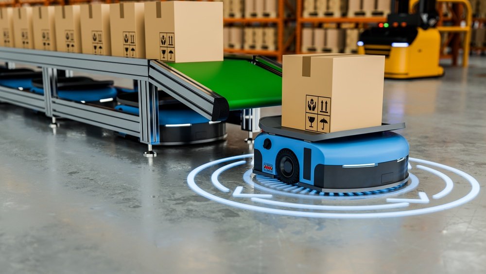 Automated guided vehicle moving a box on the production line